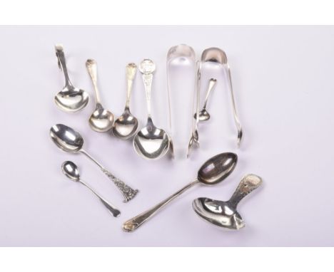 A collection of silver spoons and sugar tongsTo include; a Georgian caddy spoon, two pair of sugar tongs, a pusher spoon with