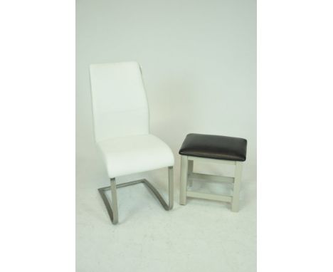 A Contemporary white leather chair   Raised on a brushed metal frame along with a padded stool on legs of square section (2) 
