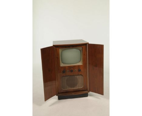 A 1950's-60's Bush television cabinet, model no: TUG36CThe bowfront cabinet with two doors enclosing a 13" black and white tv