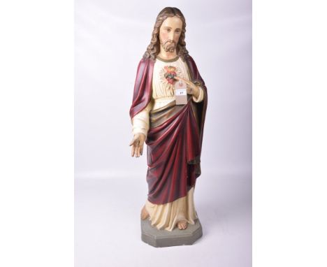 A plaster cast model 'Devotion of the Sacred Heart' mid 20th Century 
Modelled as Jesus dressed in robes on a plinth base, 91