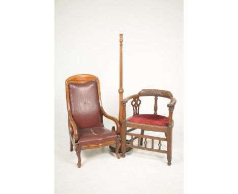 Two Victorian chairs and a lamp standardTo include a Victorian carved oak elbow chair with a leaf and flower head carved rail