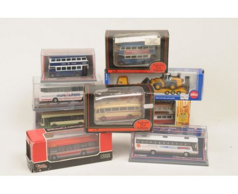 A quantity of boxed exclusive first edition models of busesCorgi classic Blackpool balloon tram, further buses, diggers etc.