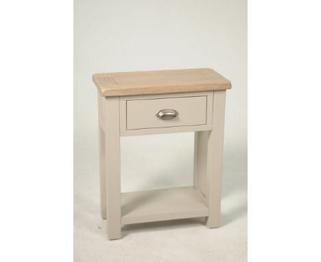 A modern stained oak and painted side tableWith an oak slab top above a single frieze drawer with brushed metal cup handle an