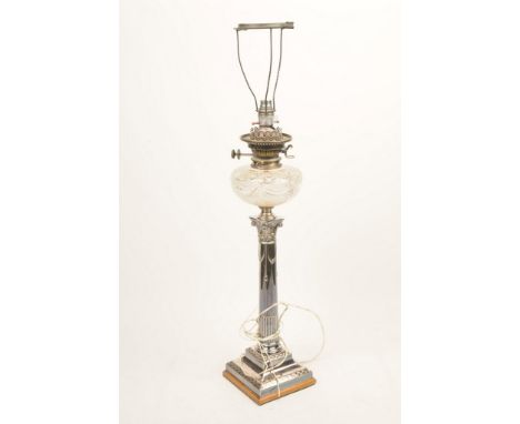 A silver-plated oil lamp, converted to electricityThe stepped base, rising to a fluted Corinthian column shaft with capital s