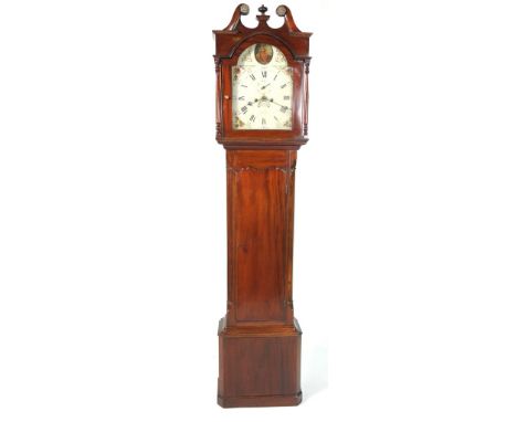 An early 19th Century mahogany cased longcase clockWith a twin swan neck pediment and central urn finial over a pair of slend