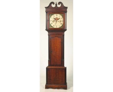 A George III oak and mahogany crossbanded long case clockWith a twin swan neck pediment and ring turned finial above two reed