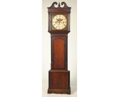 A George III oak and mahogany crossbanded long case clockWith a twin swan neck pediment and ring turned finial above two reed