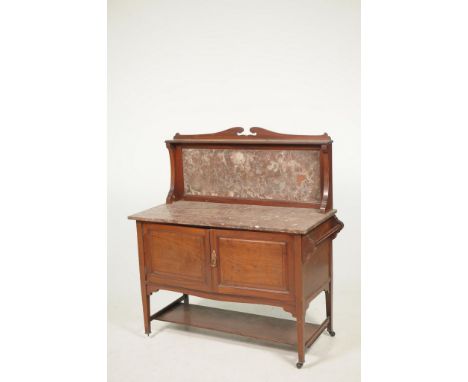 An Edwardian inlaid  mahogany marble top wash standThe rouge marble top and raised back above a pair of cupboard doors and to