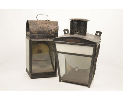 A Victorian black painted station lampOf rectangular form, glass panelled sides, a pierced gallery, looped carry handle and i