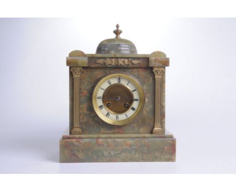 An early 20th Century green onyx mantel clockThe architectural case with domed top, applied with gilt metal columns and finia