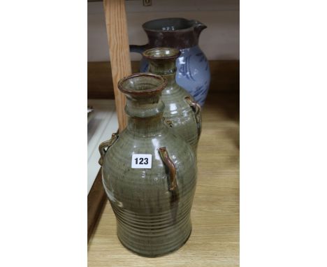 A Chris Paiton Studio pottery jug and a pair of Michael Leach Yelland pottery three handled vessels