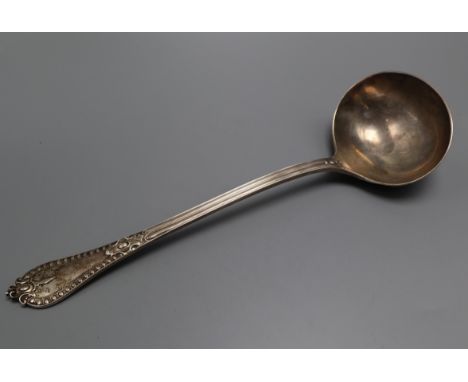 A late Victorian silver fancy pattern soup ladle, Henry Frazer,London 1893, 34cm, 10 oz.