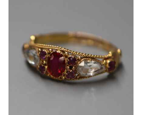 A Victorian 15ct gold, ruby, amethyst and rock crystal set dress ring, size M.