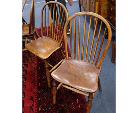 A harlequin set of eight 19th century Windsor comb back chairs