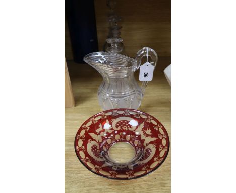 An early Victorian glass water jug, three Regency decanters and a Bohemian ruby glass bowl (5)