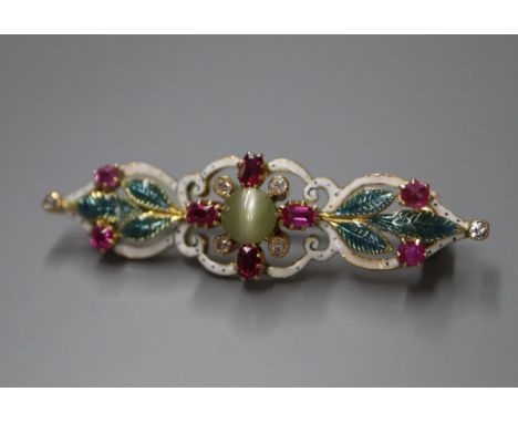 An early 20th century yellow metal, cat's eye chrysoberyl, ruby, diamond and enamel bar brooch, 39mm.