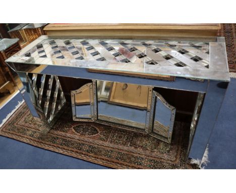 A 1970's mirrored console table