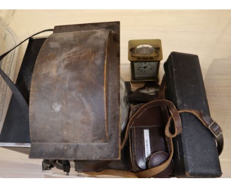 A brass carriage timepiece, a cased compass and goliath watch, two cine cameras, a clock, etc.