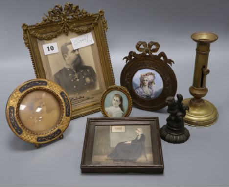 A framed portrait enamel miniature, four others, a candlestick and metal statue