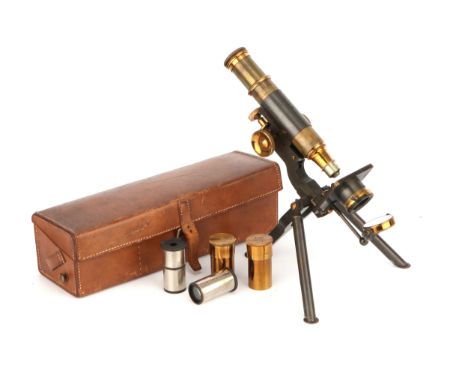 A Travelling Microscope, English, c. 1900, signed to the rear of the stand ‘Baker 244 High Holborn, London’, contained in a p
