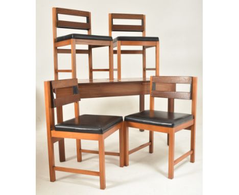 Remploy, Britain - a retro mid 20th century teak dining table with four chairs. The table having a straight rectangular top w
