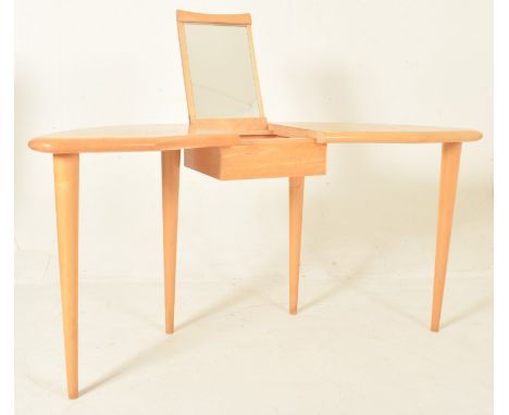 A contemporary designer maple wood dressing table desk. The table having a kidney-shaped top with a central mirrored console 