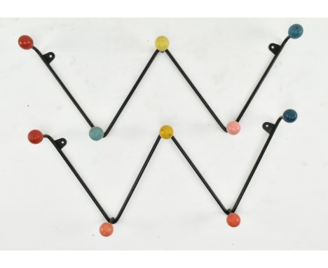 A matching pair of vintage 20th century wirework atomic / sputnik inspired coat hook / racks. Each having a W form with polyc