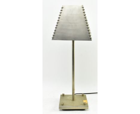 A vintage 20th century industrial desk bedside lamp. The lamp light with tapering squared shade with woven metal detail. Rais