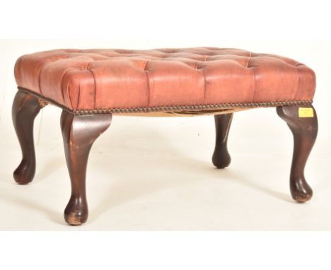 A 19th century Victorian Revival leather & mahogany button top footstool / seat. The stool having a rectangular buttoned top 