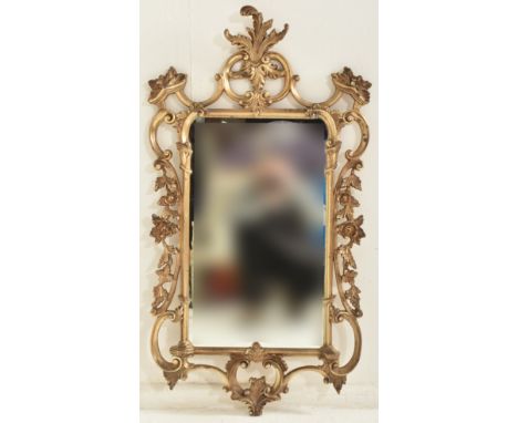 Veronese product - a vintage 20th century burnished gilt effect Rococo style wall mirror. The mirror with open worked scrolle