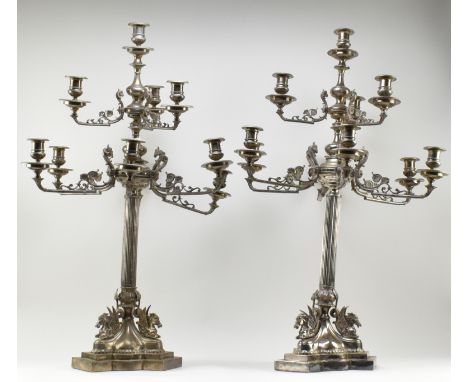 A large pair of French Empire electroplated / silver-plated seven arm candelabras. Each candelabra having a top candle holder