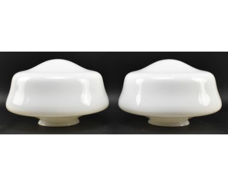 A pair of early to mid century opaline glass ceiling light shades. Each shade lacking fitting, of circular form with central 
