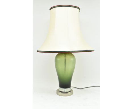 Rochamp - a modernist high end designer glass bedside desk lamp. The lamp in olive green colourway, with textured glass bulbo