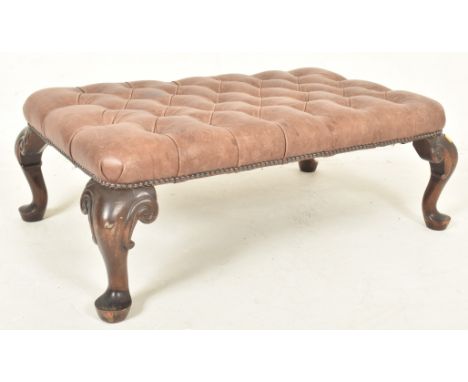 A large 19th century Victorian Revival leather & mahogany button top footstool / seat. The stool having a rectangular buttone