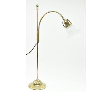 An Italian Art Deco Liberty early 20th century circa 1930s brass cantilever arm desk table lamp light. The lamp having a curv