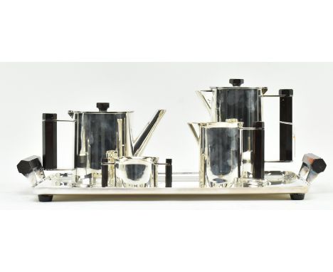 Trench art military interest - a vintage mid century four piece tea service formed from reclaimed WWII artillery shells. The 
