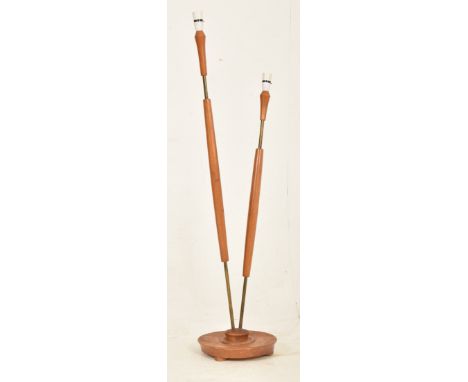 A vintage mid century circa 1960s twin armed angular floor standing teak &amp; brass standard lamp. The lamp light with twin 