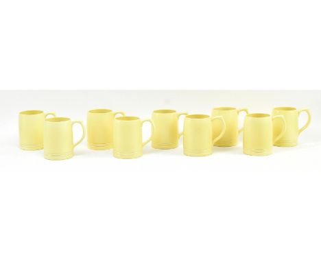 Keith Murray for Wedgwood - a set of nine vintage mid century ceramic beer mugs / steins. Each mug in a cream yellow colourwa