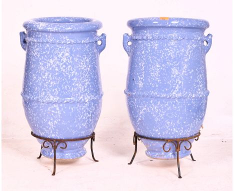 A pair of large vintage blue glazed terracotta garden outdoor decorative amphora vases on stands. Each having a rolled rim wi