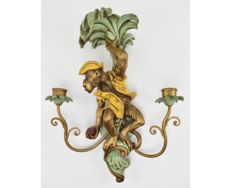 A contemporary French style painted wood &amp; metal whimsical monkey shaped wall light sconce. The light having a monkey dre