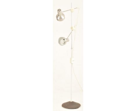A retro 20th century 1970s floor standing lamp light. The lamp having twin adjustable spotlights with aluminium shades and sw