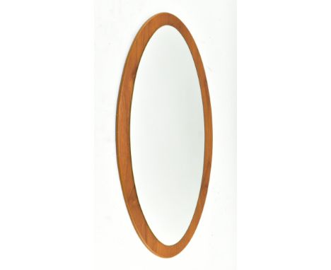 A vintage mid century 1960s oval shaped teak framed mirror. The mirror of extended oval shaped form.Measures approx. 80cm x 4