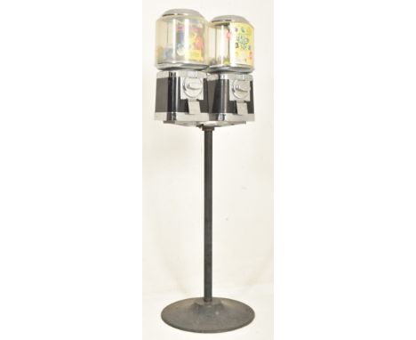 Beaver - two vintage 20p coin operated black sweet shop candy vending machines on stand. Each confectionary dispenser with a 