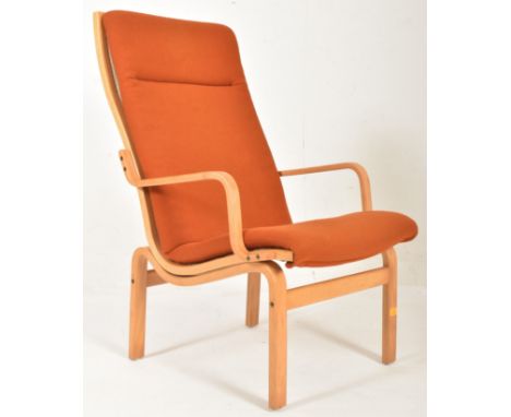 Finn Ostergaard - a vintage mid century 1970s oak and orange upholstered armchair. The armchair with orange fabric upholstery
