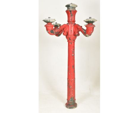 A large 20th century Victorian style cast metal exterior candelabra light post. The post having four sweeping arms supported 