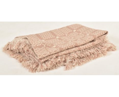 A vintage 20th century hand woollen traditional Welsh blanket. The blanket in hues of cream and cappucino, featuring recurrin