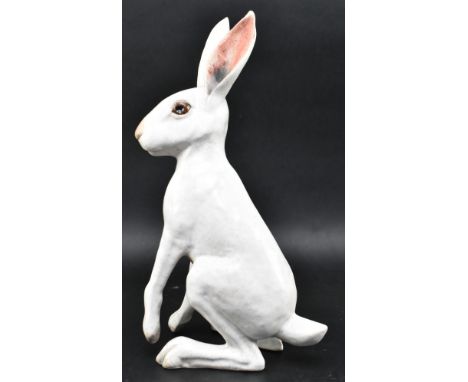 Brian Andrews - a vintage raku glazed studio pottery figurine of a hare. The hare depicting standing with one paw raised. Whi
