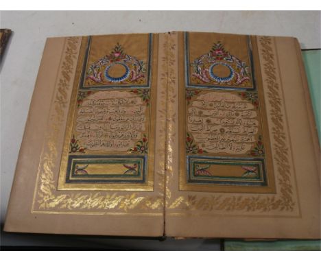 THE KORAN: Illuminated manuscript, over 300 pp. contemporary leather flipover (detached), gilt painted page edges, 175 x 110m