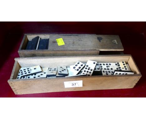 Two antique sets of bone top dominoes