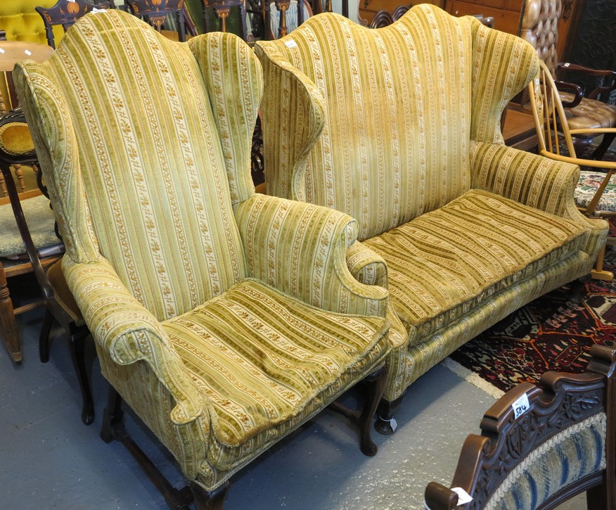 Queen Anne style upholstered two seater wing sofa with scroll over arms